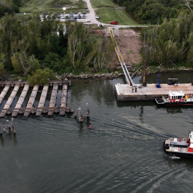 October 9, 2023: An aerial view shows low water levels on the Mississippi River in Belle Chasse, Louisiana, revealing pipes that are typically underwater. The low water levels caused barges and ships to run aground along parts of the Mississippi River in October and created saltwater intrusion concerns in southern Louisiana. (Image credit: Justin Sullivan/Getty Images)